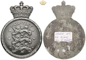 Polititegn uden nummer og ring, men med fire huller